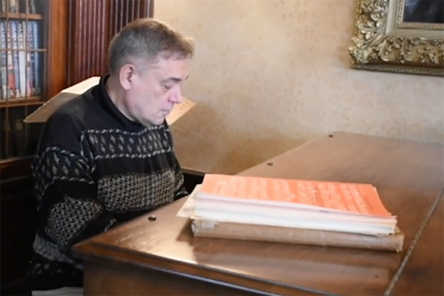 US computer science, imaginative writing and music teacher Jon Shipley plays his grand piano; he also plays the oboe and other instruments.