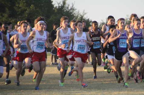 Baird (2nd), Newton (10th), and Stratton (5th) pose with their medals after the Burleson Elk Run.