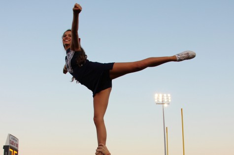 During Stovall's last game on the Rosacker Stadium sidelines, she exhibits stellar form in her arabesque stunt.
